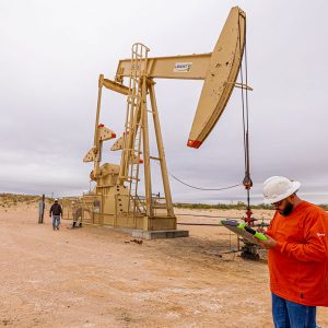 Worker monitoring pump jack